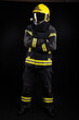 © blanke1973 - Firefighter in full firefighting gear on a black background