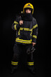 © blanke1973 - Firefighter in full firefighting gear on a black background