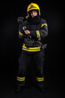 © blanke1973 - Firefighter in full firefighting gear on a black background