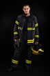 © blanke1973 - Firefighter in full firefighting gear on a black background