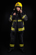 © blanke1973 - Firefighter in full firefighting gear on a black background