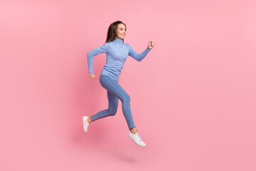 Canvas Print - Profile photo of cheerful active lady jump run empty space wear blue turtleneck jeans sneakers isolated pink color background