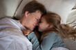 © Aleksandra Iarosh - little cute girl hugging her dad while lying in bed