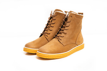 brown leather winter boots with lacing on a white background