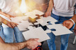 © alphaspirit - Teamwork of partners connect puzzle pieces as integration and startup