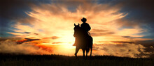 Cowboy On A Horse At Sunset