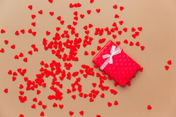 Wall Mural - Valentine's Day concept with red hearts and gift box. Flat lay, copy space