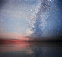 Wall Mural - sailing over calm waters and under a starry sky