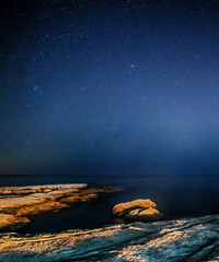 Wall Mural - night sky and rocky shore at selmun