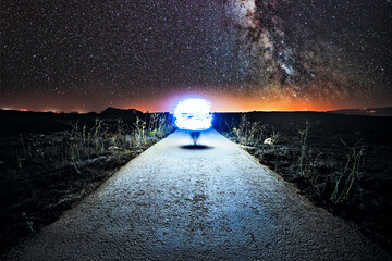 Wall Mural - an orb-like spaceship lands on a quiet rural country road