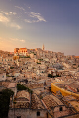 Wall Mural - Wide view of Piazzetta Pascoli, Belvedere di Matera sul Sasso Caveoso, at sunset, vertical