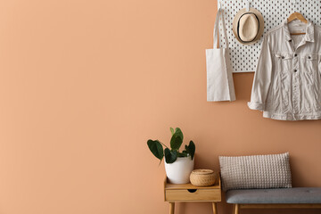 Interior of stylish hall with bench and pegboard