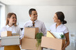 © Pixel-Shot - Business people holding boxes with things in office on moving day