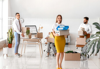 Wall Mural - Business people packing things in office on moving day