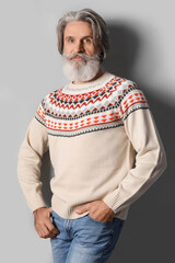 Sticker - Handsome senior man in knitted sweater on grey background