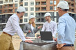 © zinkevych - Friendly inspector talking to construction workers outdoors
