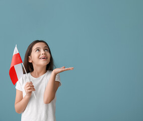 Canvas Print - Cute little girl with flag of Poland on color background