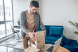 © zinkevych - Concentrated Internet shop worker packing goods for shipping