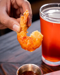 Sticker - Tasty breaded shrimp accompanied by a craft beer.