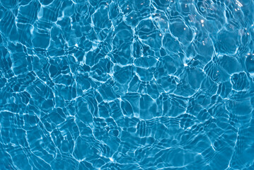  Shining blue water ripple background. Summer concept.