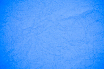 Crumpled blue paper background.