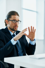 Wall Mural - business man wearing glasses work desk computer office manager