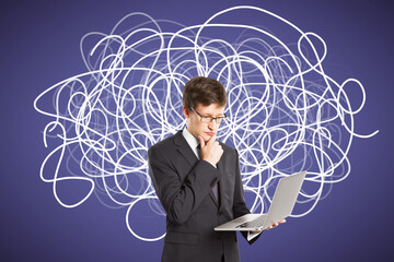 Wall Mural - Portrait of attractive young european businessman with laptop and abstract scribble on blue background. Question, think and confusion concept.