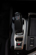 Modern automatic transmission parked inside the interior of a modern vehicle. Soft selective focus.