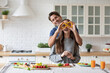 © BestForYou - Young couple in love, cooking together, having fun in the kitchen at home.