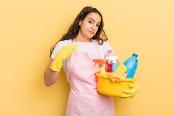 Wall Mural - young pretty hispanic woman looking arrogant, successful, positive and proud. housework an clean products concept