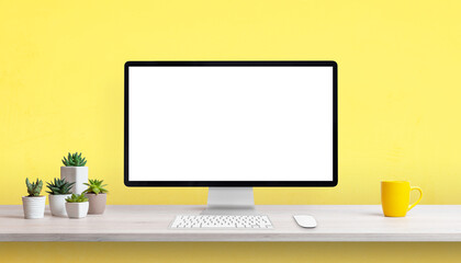 Aufkleber - Creative work desk with blank computer display, yellow coffee mug and plants. Yellow background with copy space
