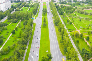 Wall Mural - Aerial view of the highway. Straight two-way road through the park.