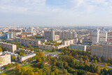 Fototapeta Paryż - Autumn city park among apartment buildings from a height.