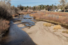 Monument Creek Running Through Colorado Springs, Urban Waterway In A Winter Landscape, Horizontal Aspect