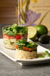 © ADDICTIVE STOCK - Delicious salad with rice, tomato and arugula cooked in round shape