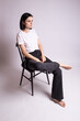 © Диана Шиловская - woman in white t-shirt sits on a chair