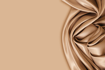 Wall Mural - Photography of beautiful elegant wavy beige / light brown satin silk luxury cloth fabric texture with monochrome background design. Copy space. Card or banner