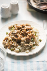 Wall Mural - Chicken shoarma with mushrooms in creamy sauce served with rice and peas