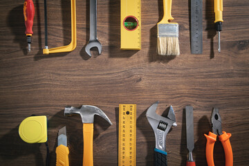 Wall Mural - Work tools on the wooden background.