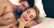 © Yuri A/peopleimages.com - Finding comfort in his arms. High angle shot of an affectionate young couple sleeping in bed together.