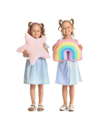 Poster - Adorable little sisters with pillows on white background