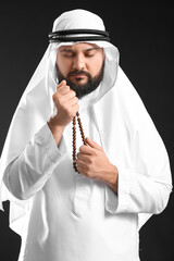 Sticker - Muslim man praying on black background