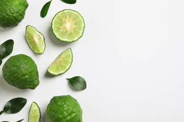 Wall Mural - Flat lay composition with ripe bergamot fruits on white background. Space for text