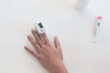 Pulse oximeter on a woman's finger. blood oxygen saturation. The patient measures the saturation of the blood with an electronic pulse oximeter on the finger