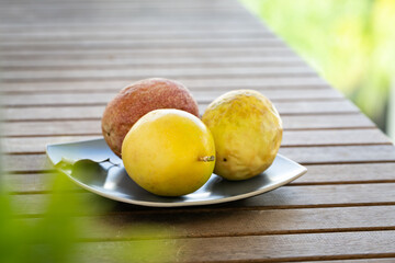 Wall Mural - Exotic passion fruit on plate, tropical food