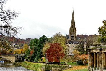 georgian architecture surrounded by autumn foliage, on the bank of the river avon in bath, england