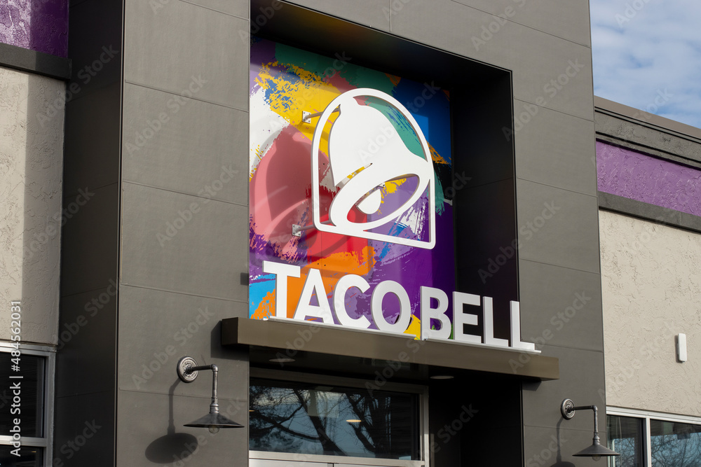 Portland, OR, USA - Jan 16, 2022: Closeup of the Taco Bell logo seen at the entrance to one of its chain restaurants in Portland, Oregon. Taco Bell is a subsidiary of Yum! Brands, Inc.