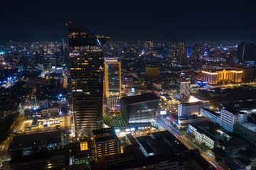 Wall Mural - Top View of Building in a City - Aerial view Skyscrapers flying by drone of Phnom Penh city with downtown , riverside and sunset