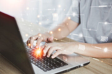 Hands typing on a computer keyboard, using technology, searching for information, security, protecting data privacy