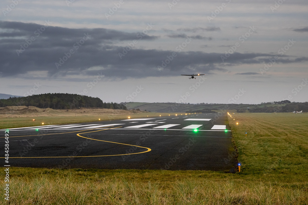 Silhouette of a small one engine airplane taking off from a small ...